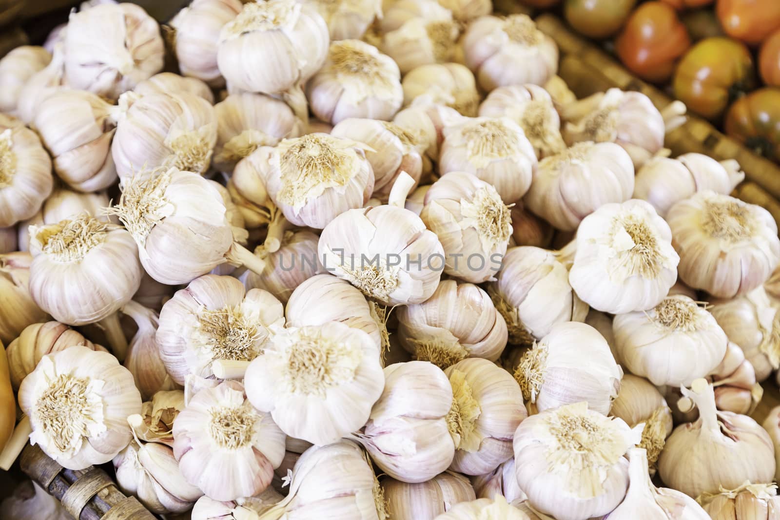 Dried garlic on a market, detail of a raw vegetable in a shop on the street, healthy food, diet