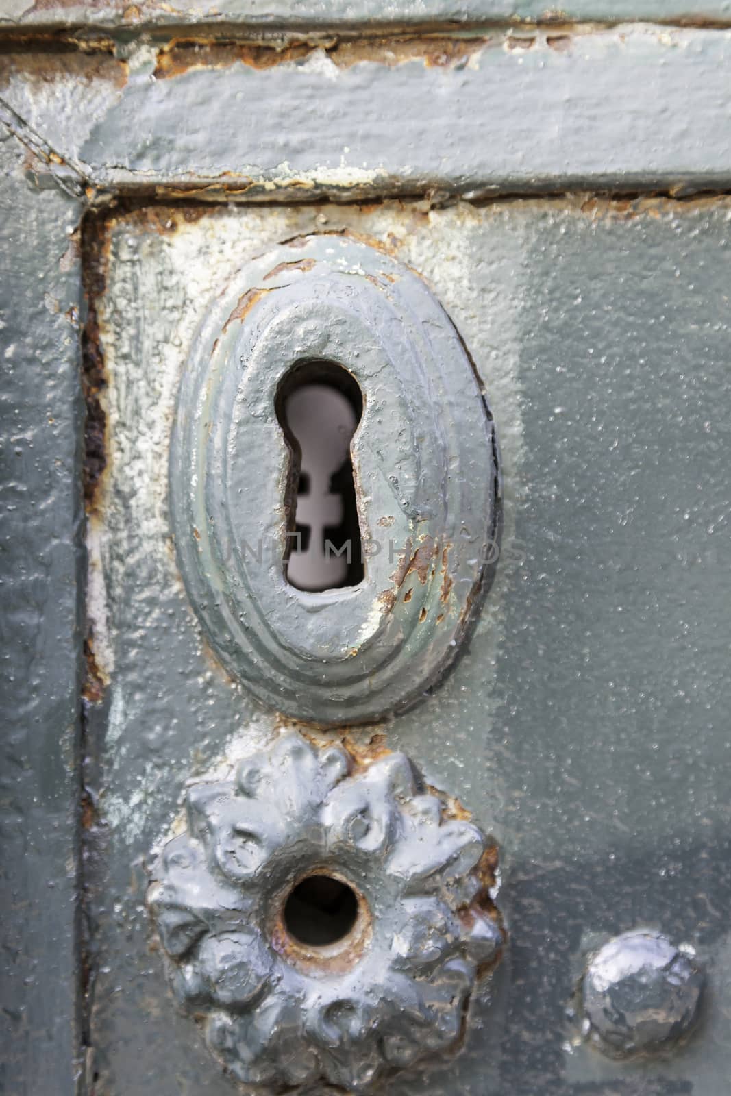 Old rusty lock, detail of an old abandoned city, textured background, rust and mold door