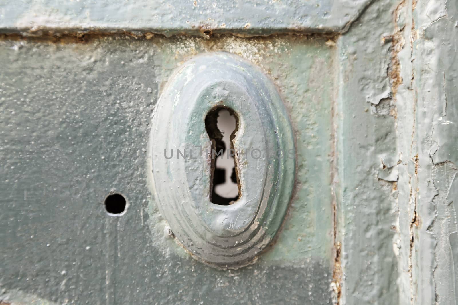 Old rusty lock, detail of an old abandoned city, textured background, rust and mold door
