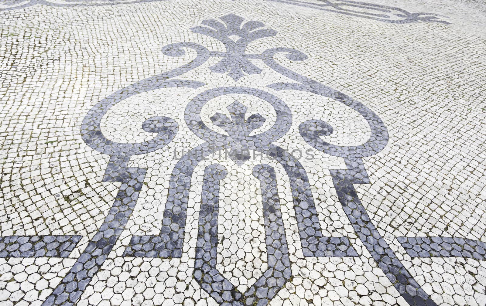 Lisbon typical mosaic, detail of a typical floor of Portugal, decorative mosaic on a typical street of Lisbon