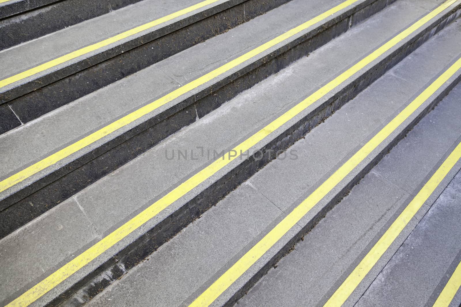 Steps with yellow signs, detail of stairs with protective signals