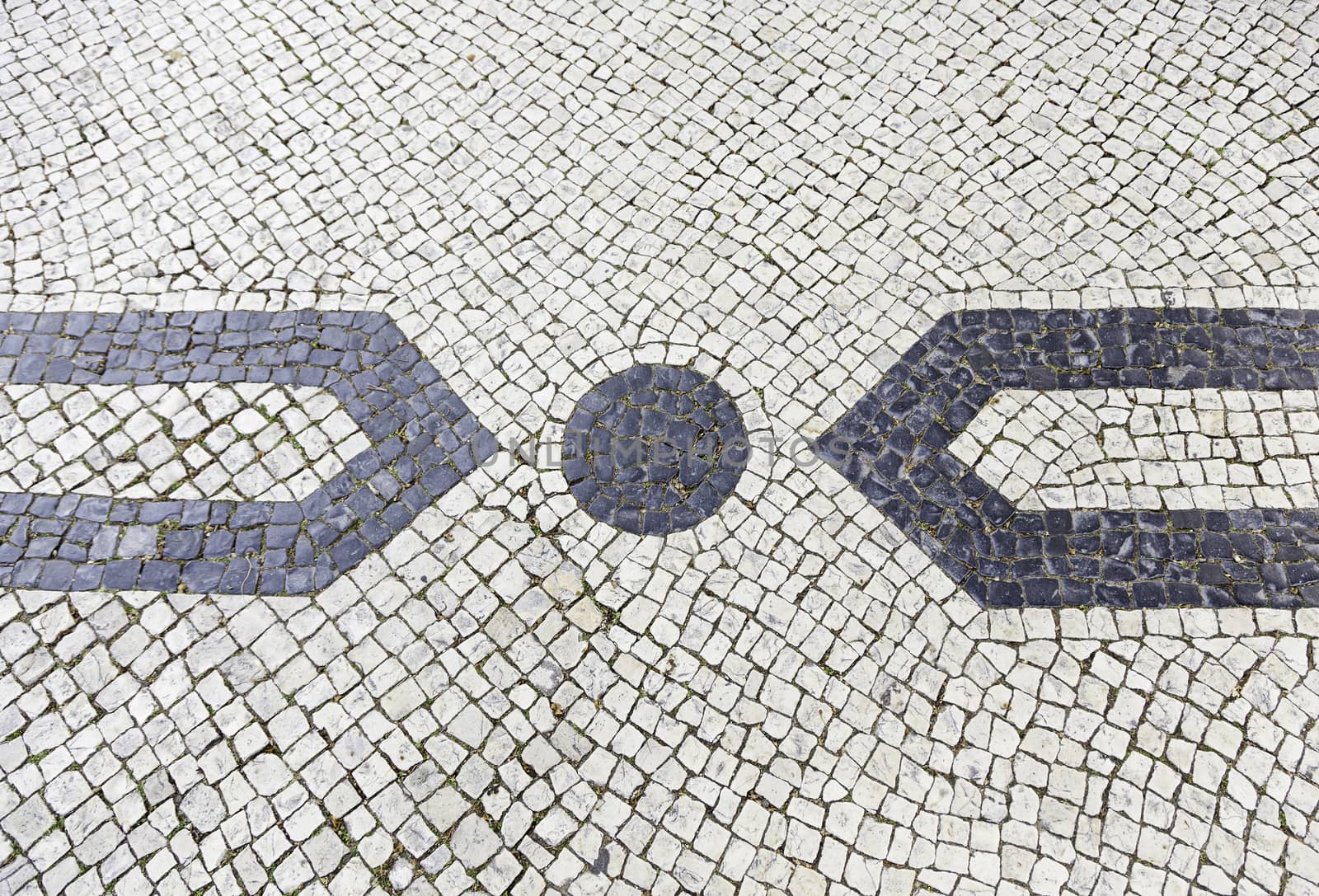 Lisbon typical mosaic, detail of a typical floor of Portugal, decorative mosaic on a typical street of Lisbon