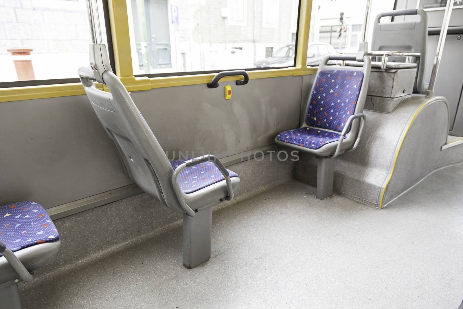 Seating inside a tram, detail of a public transport in the city