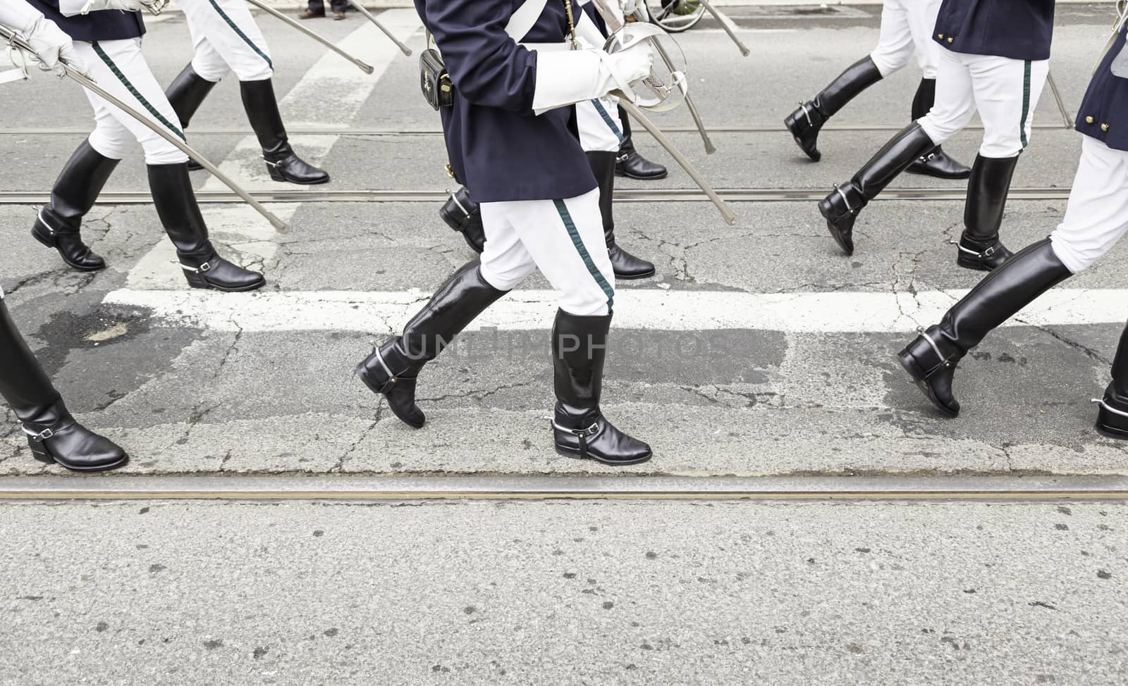 Legs in a military parade, detail of legs with former military costume