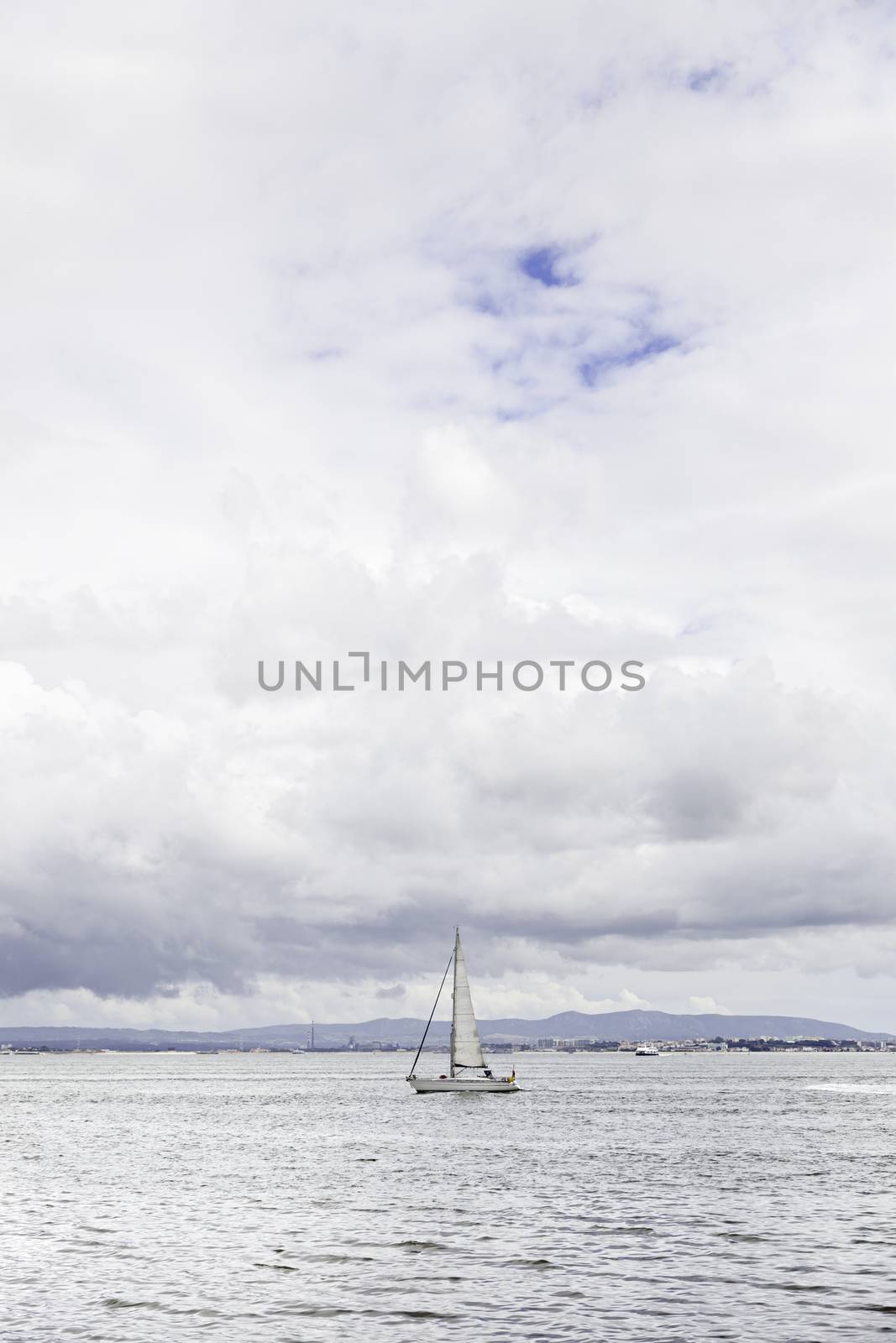 Pleasure boat on a river of Lisbon, detail of a ship sailing