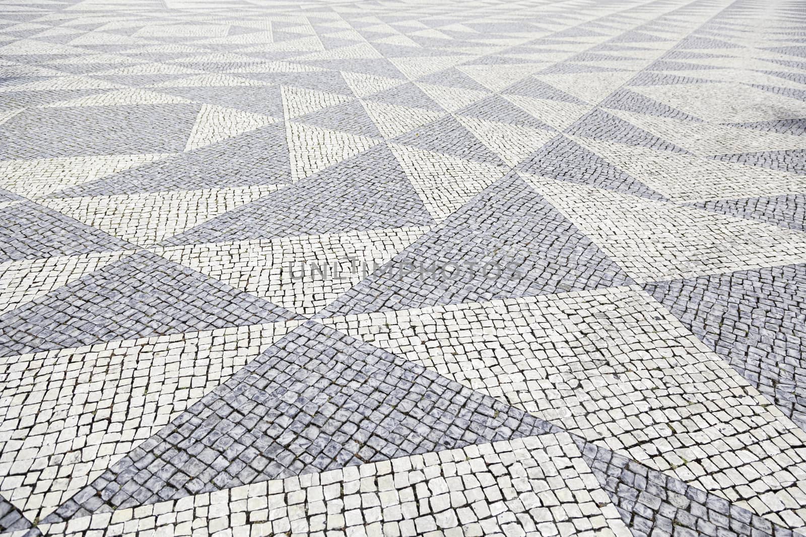 Typical stone floor Lisbon, detail of a typical floor with shapes and drawings, art Portugal, tourism
