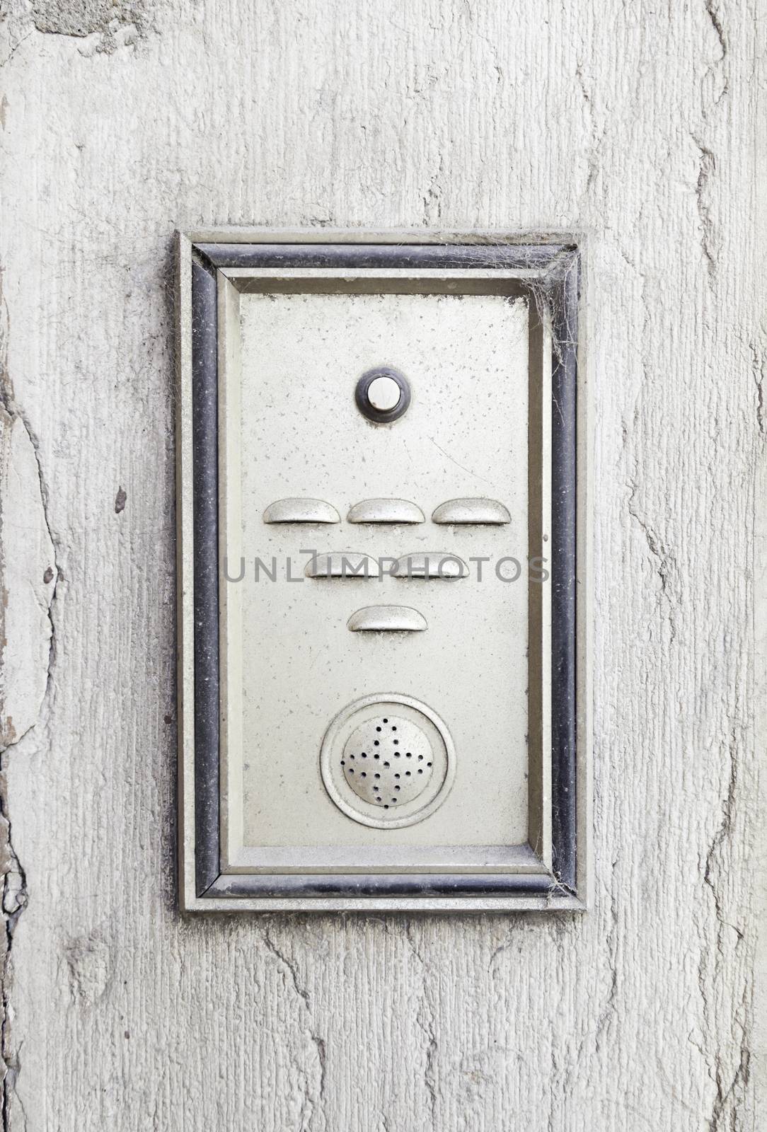 Old intercom in a house, detail of a electric apparatus in the facade of a building