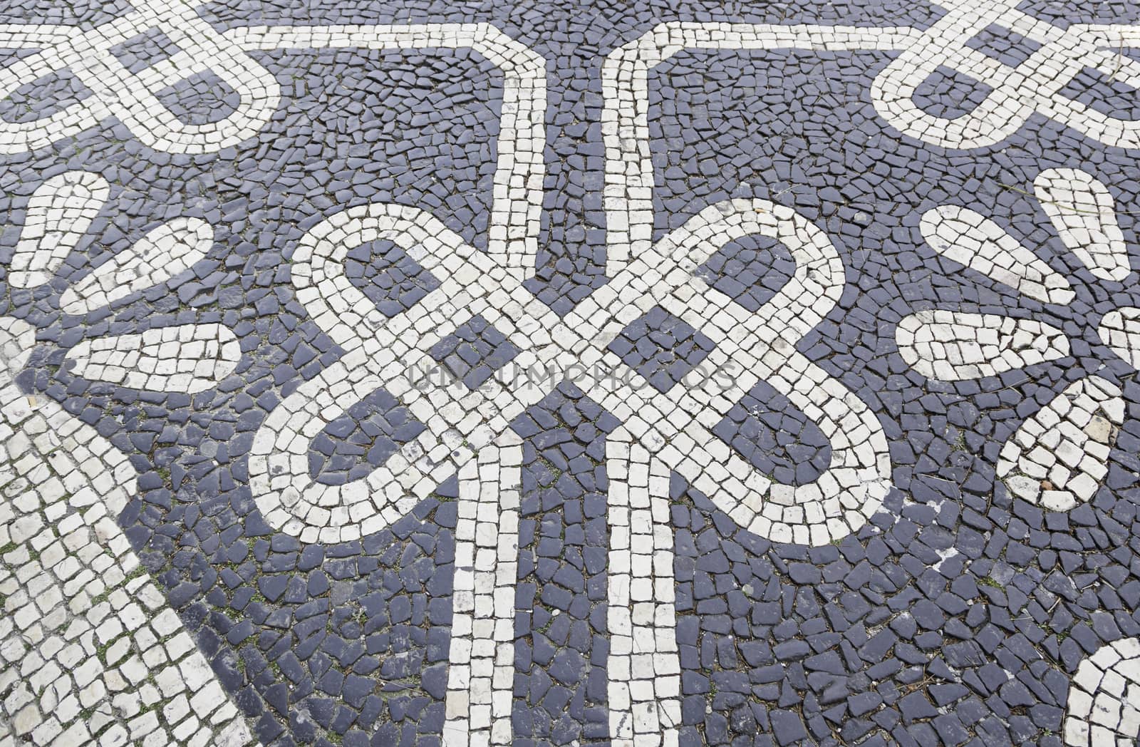 Typical stone floor Lisbon, detail of a typical floor with shapes and drawings, art Portugal, tourism