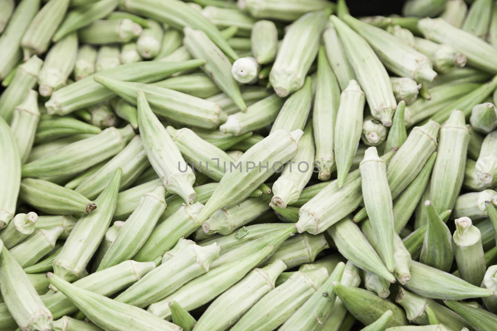 Green chillies in a market, detail spicy vegetables in a shop in a market