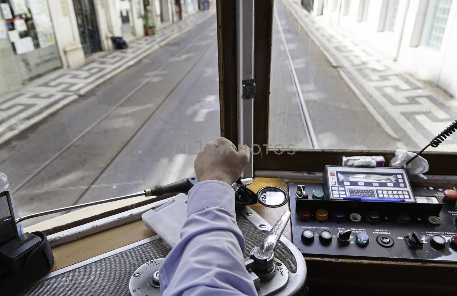 Driver tram in Lisbon, detail of a person wearing an old tram travelers in Portugal