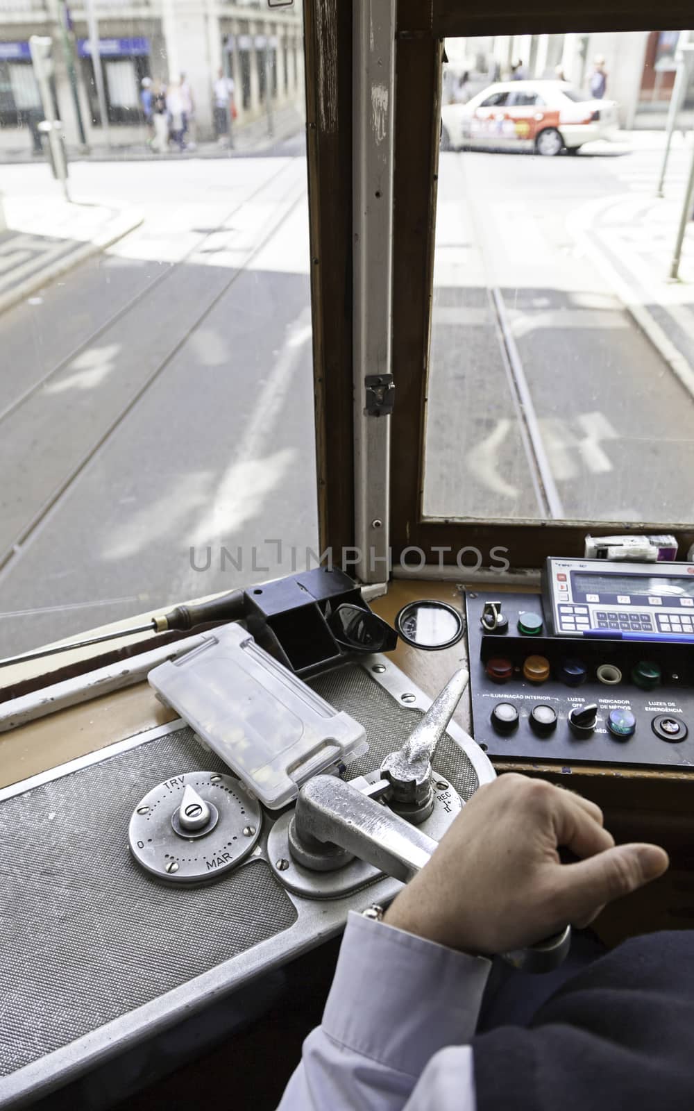 Driver tram in Lisbon, detail of a person wearing an old tram travelers in Portugal