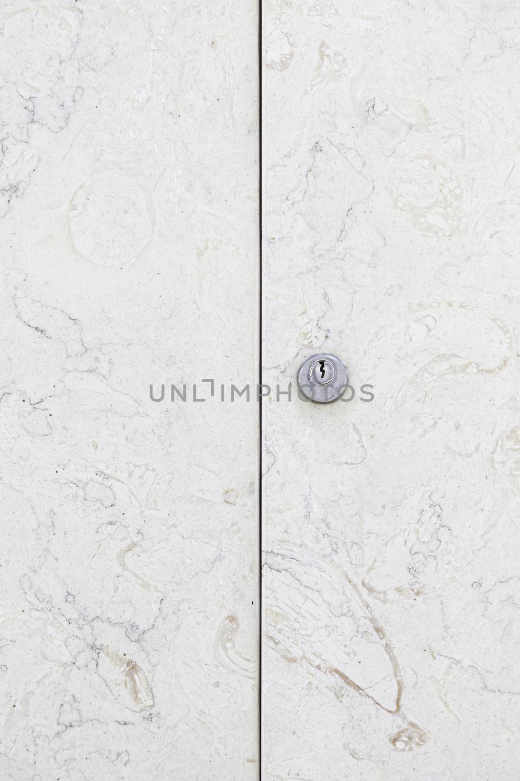 Marble door closed, detail of a stone door, decoration and protection