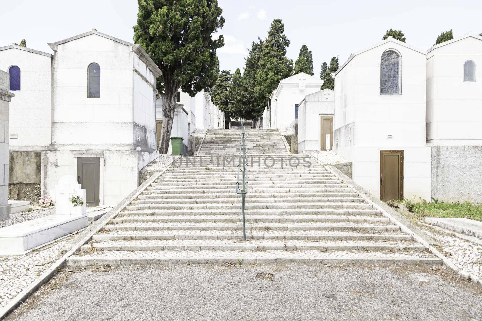 Old cemetery in the city of Lisbon, detail of a Christian tombs, ancient art in the city, holy place