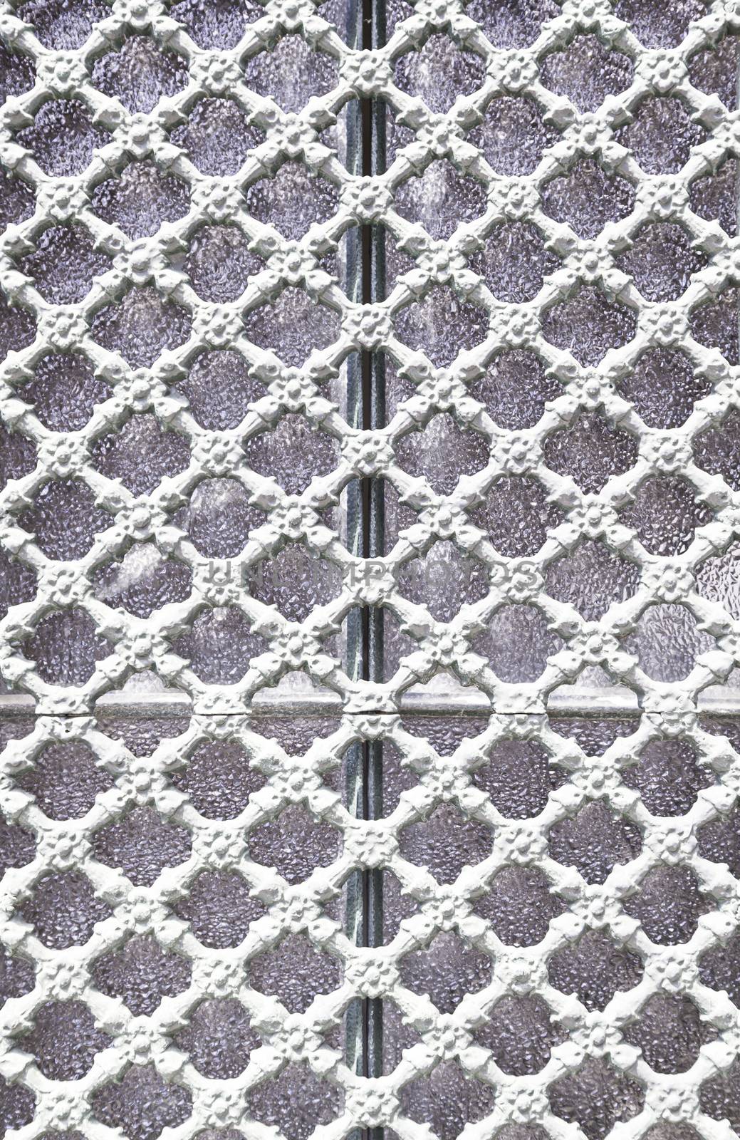 Old metal gate decorated, detail of an old fence painted white, protection and decoration