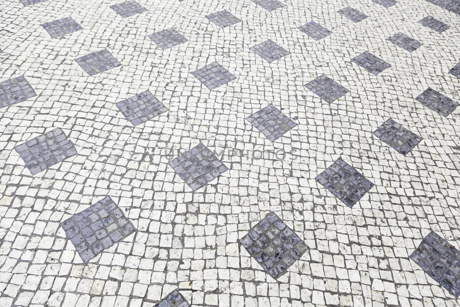 Typical stone floor Lisbon, detail of a typical floor with shapes and drawings, art Portugal, tourism