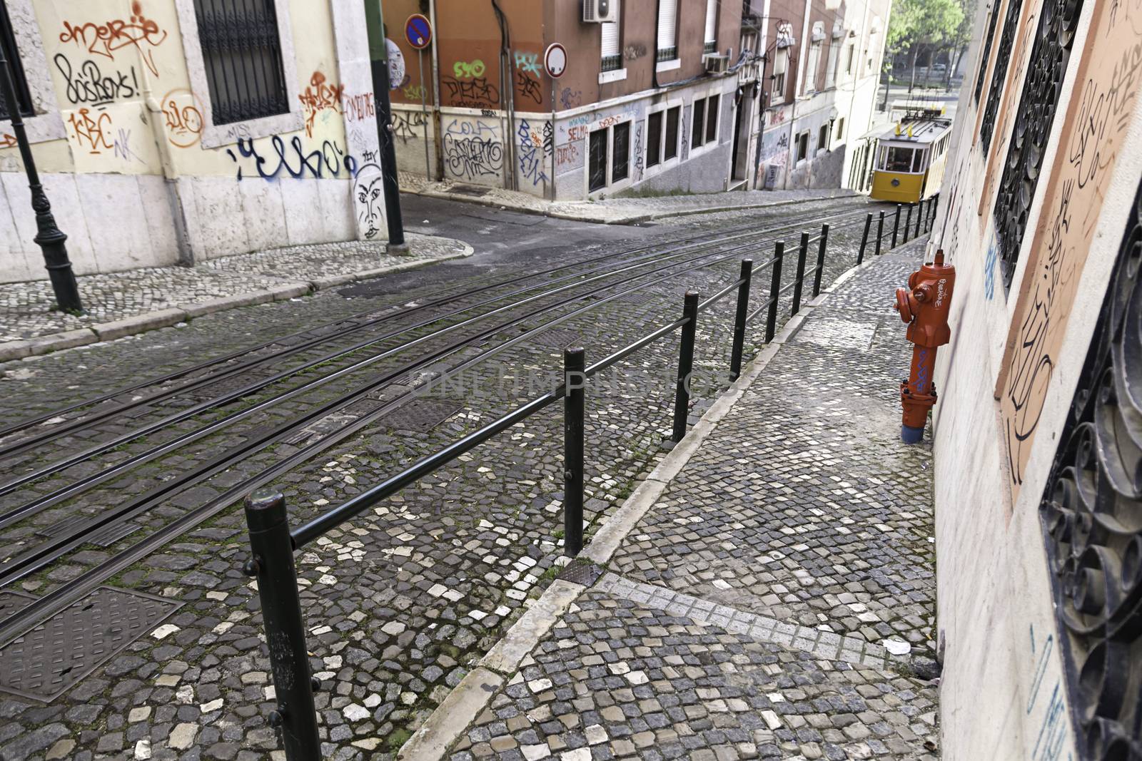 Tram on a street in Lisbon, detail of an old city transport, and tourism monument