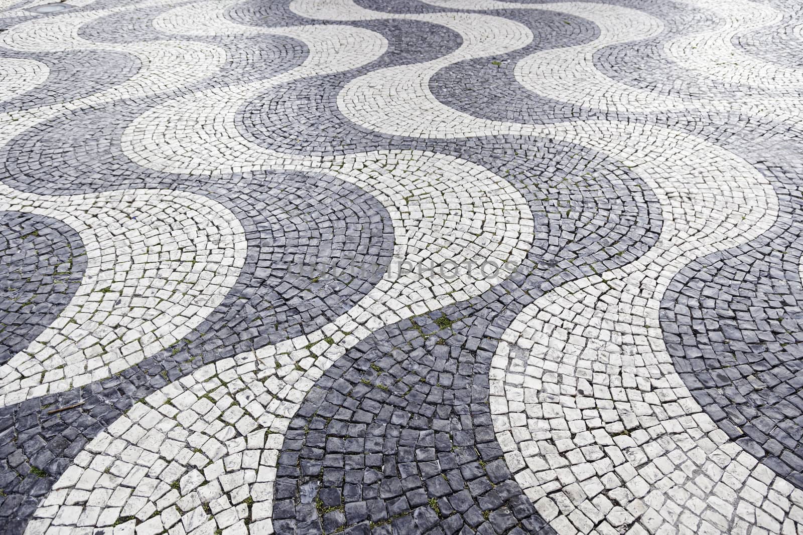 Typical stone floor Lisbon, detail of a typical floor with shapes and drawings, art Portugal, tourism