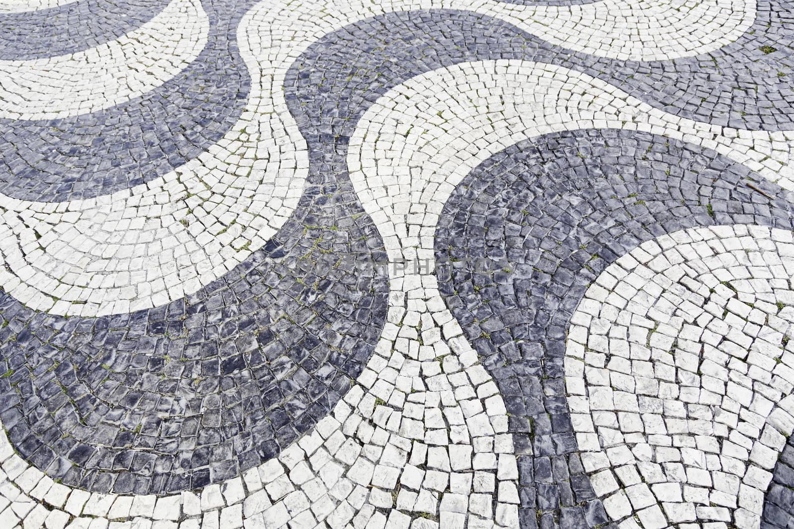 Typical stone floor Lisbon, detail of a typical floor with shapes and drawings, art Portugal, tourism