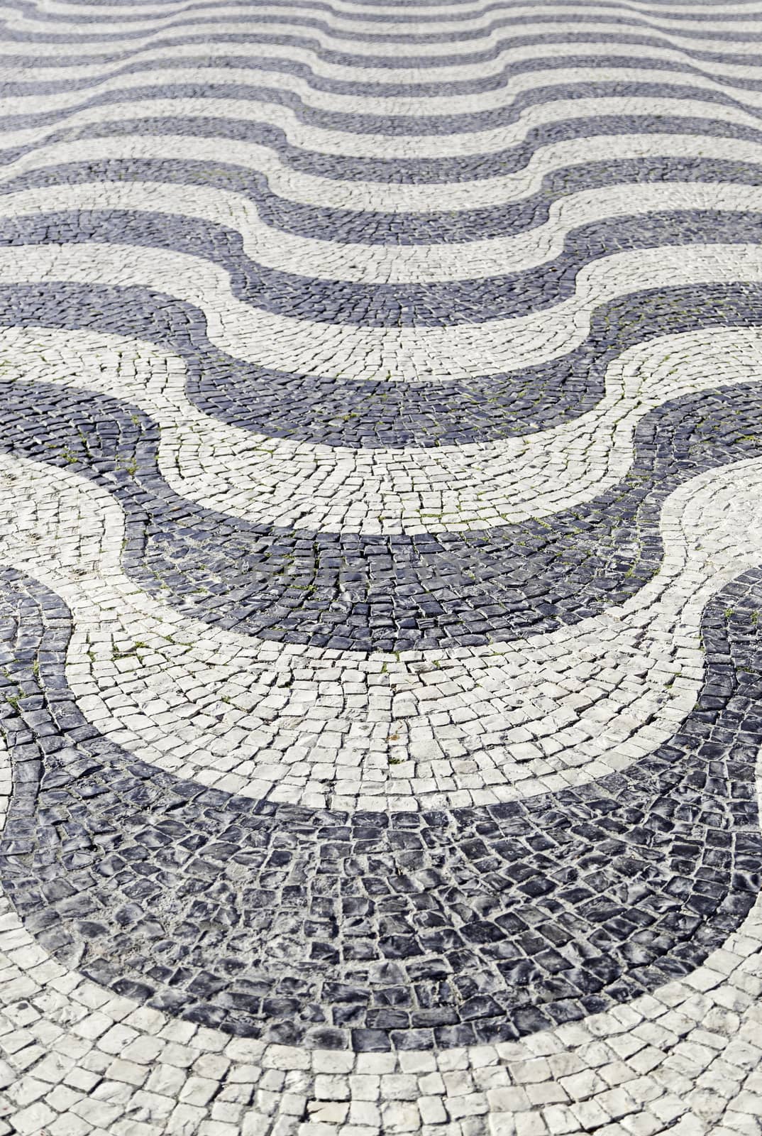 Typical stone floor Lisbon, detail of a typical floor with shapes and drawings, art Portugal, tourism