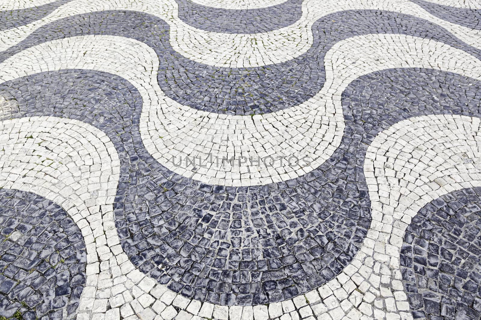 Typical stone floor Lisbon, detail of a typical floor with shapes and drawings, art Portugal, tourism