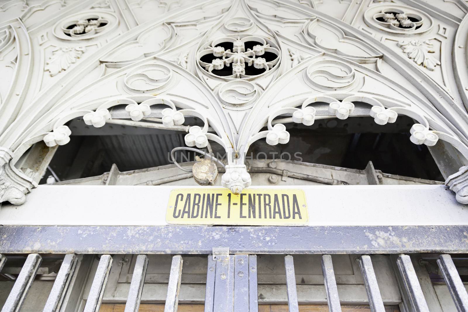 Entry of an elevator, detail of an old metal door closed