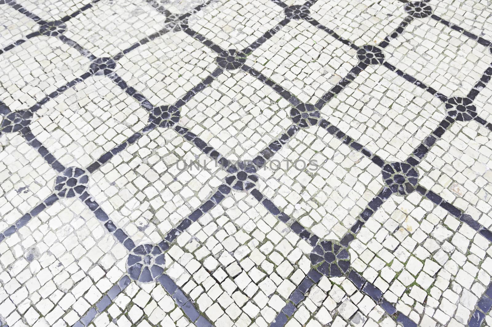 Typical stone floor Lisbon, detail of a typical floor with shapes and drawings, art Portugal, tourism