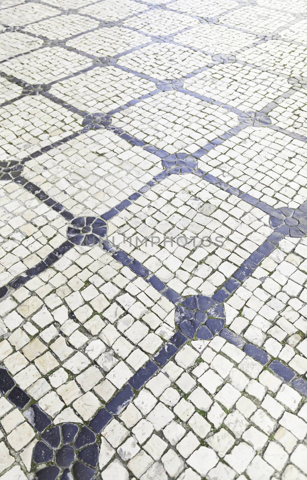 Typical stone floor Lisbon, detail of a typical floor with shapes and drawings, art Portugal, tourism