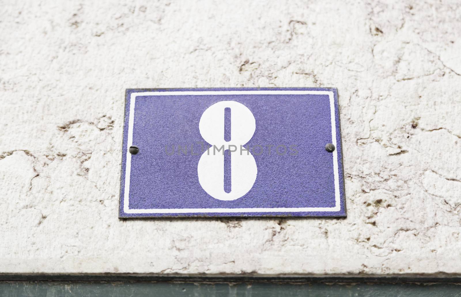 Number eight on a wall, detail of a number