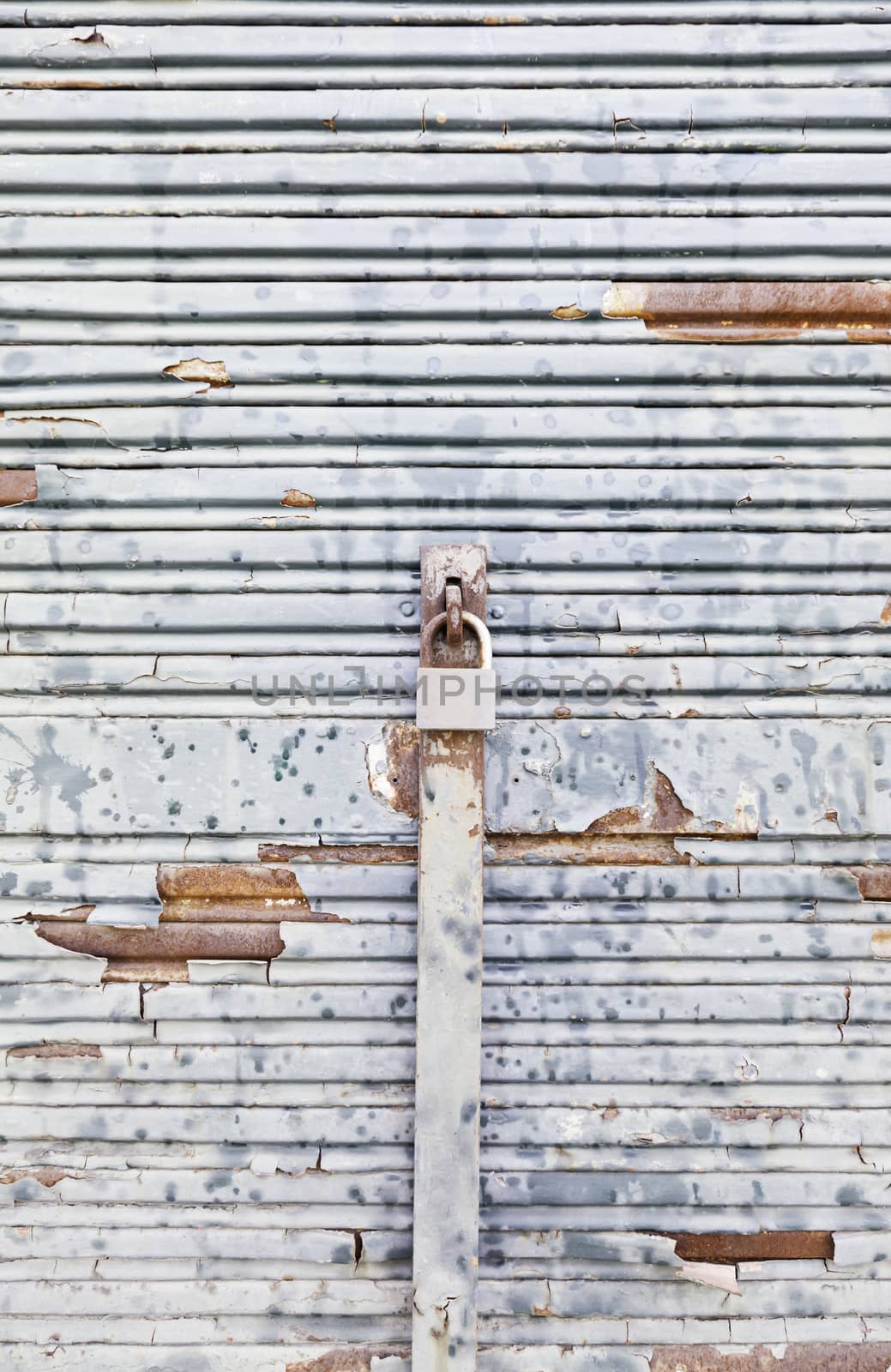 Chipped and rusty metal wall, detail of a down and dirty in ciuad wall, background with texture