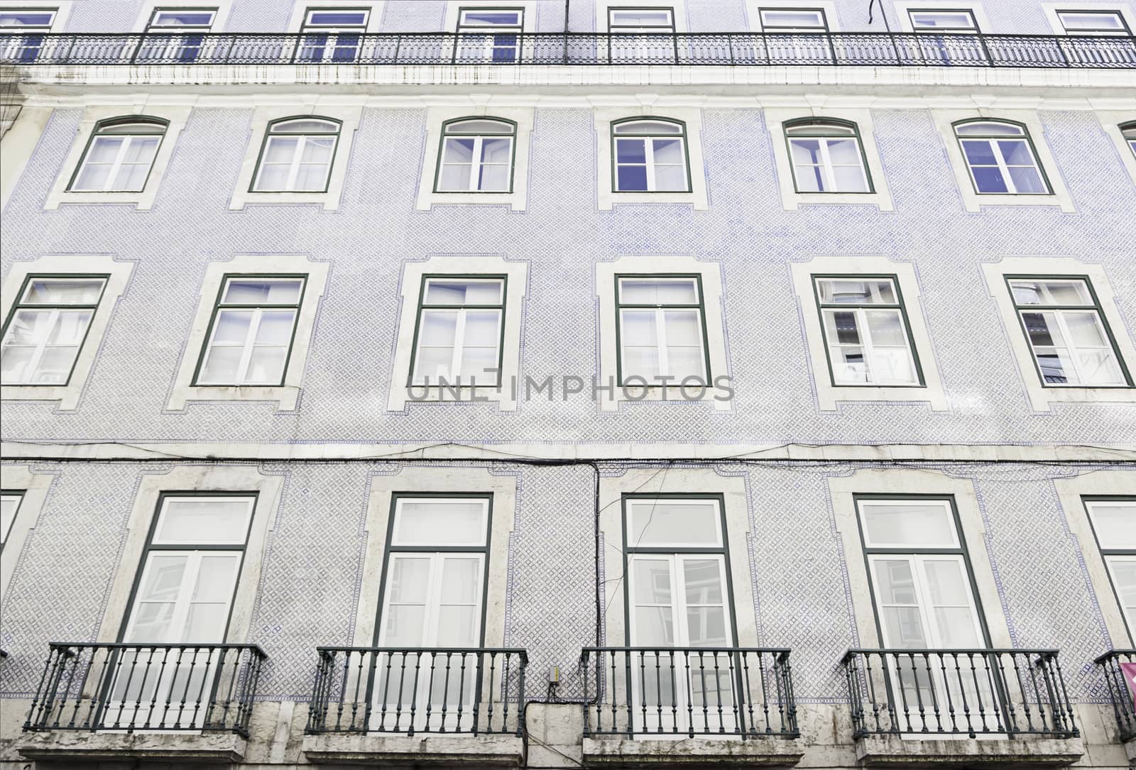 Typical facade tiles in Lisbon, facade detail of an ancient decorated