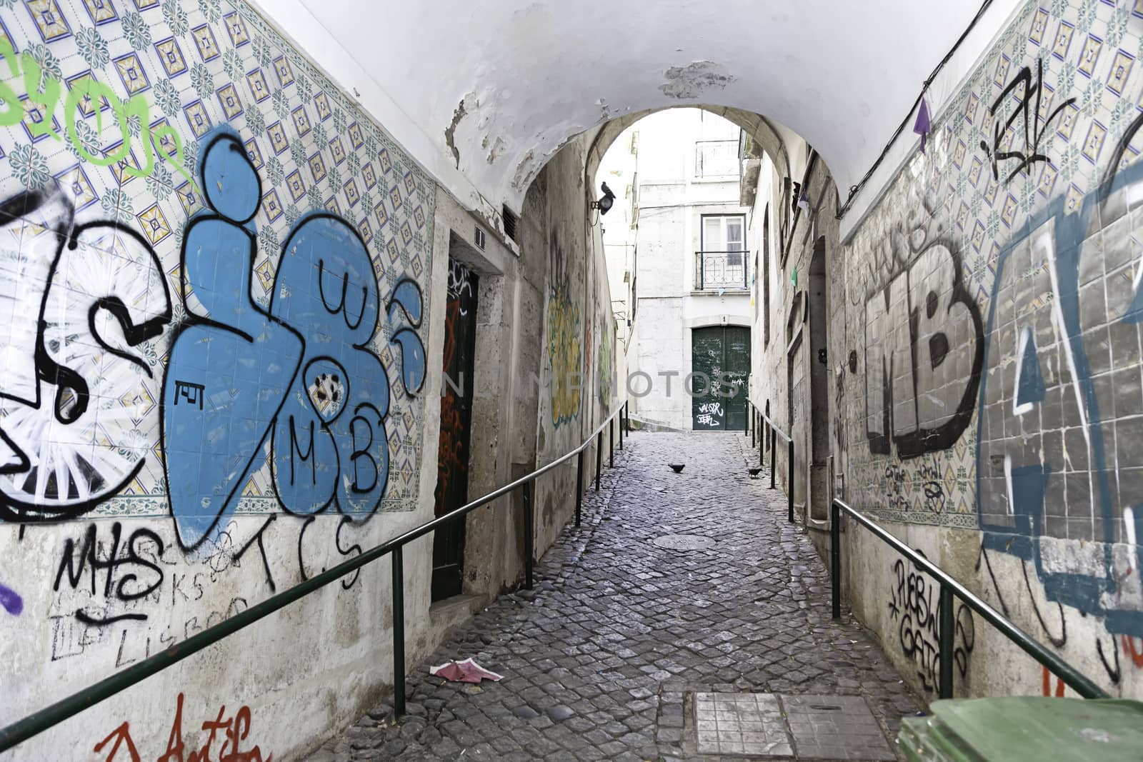 Old alley in Lisbon, detail of an old and battered city street, old town
