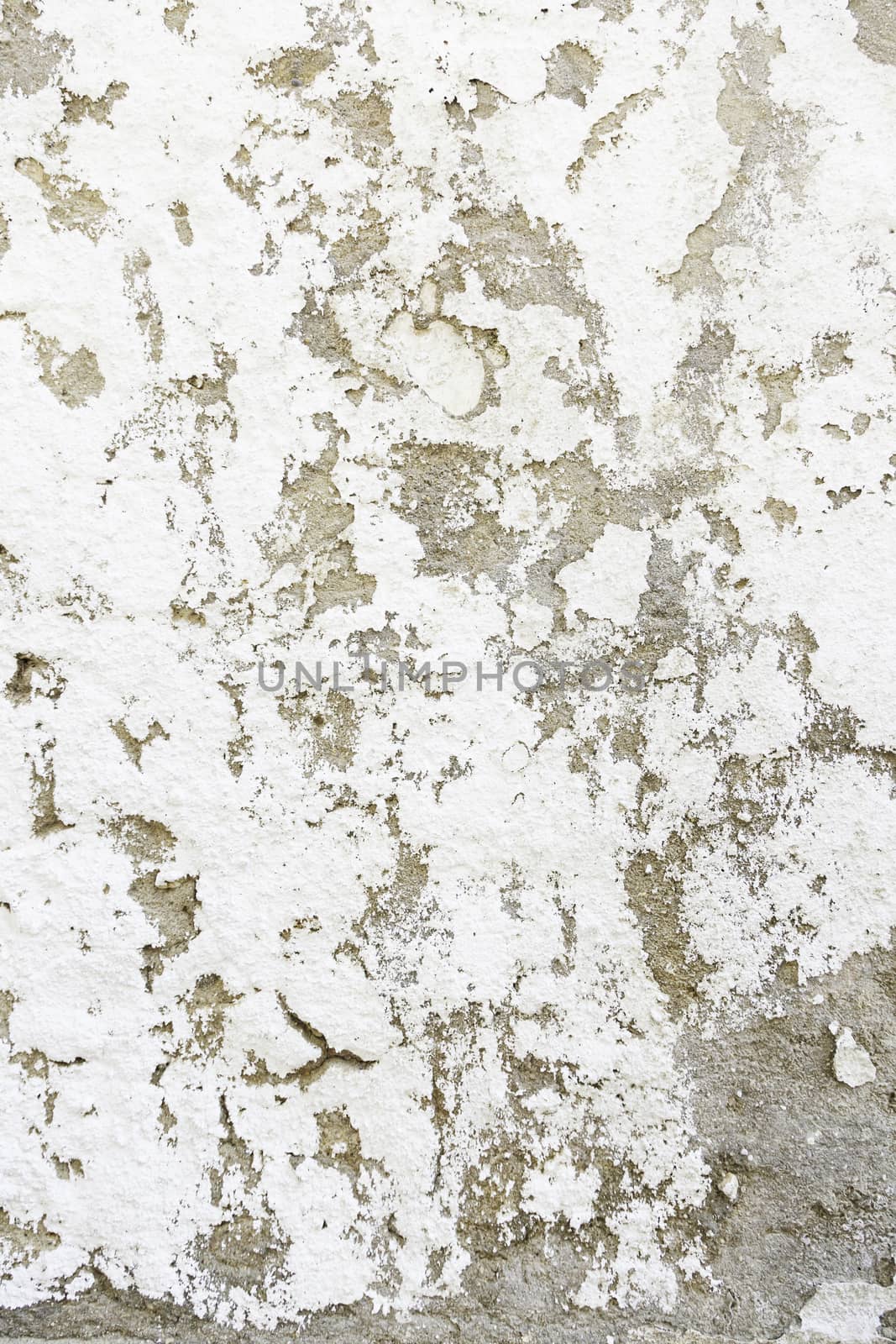 Abandoned peeling painted wall detail of an old ruined wall, background with texture