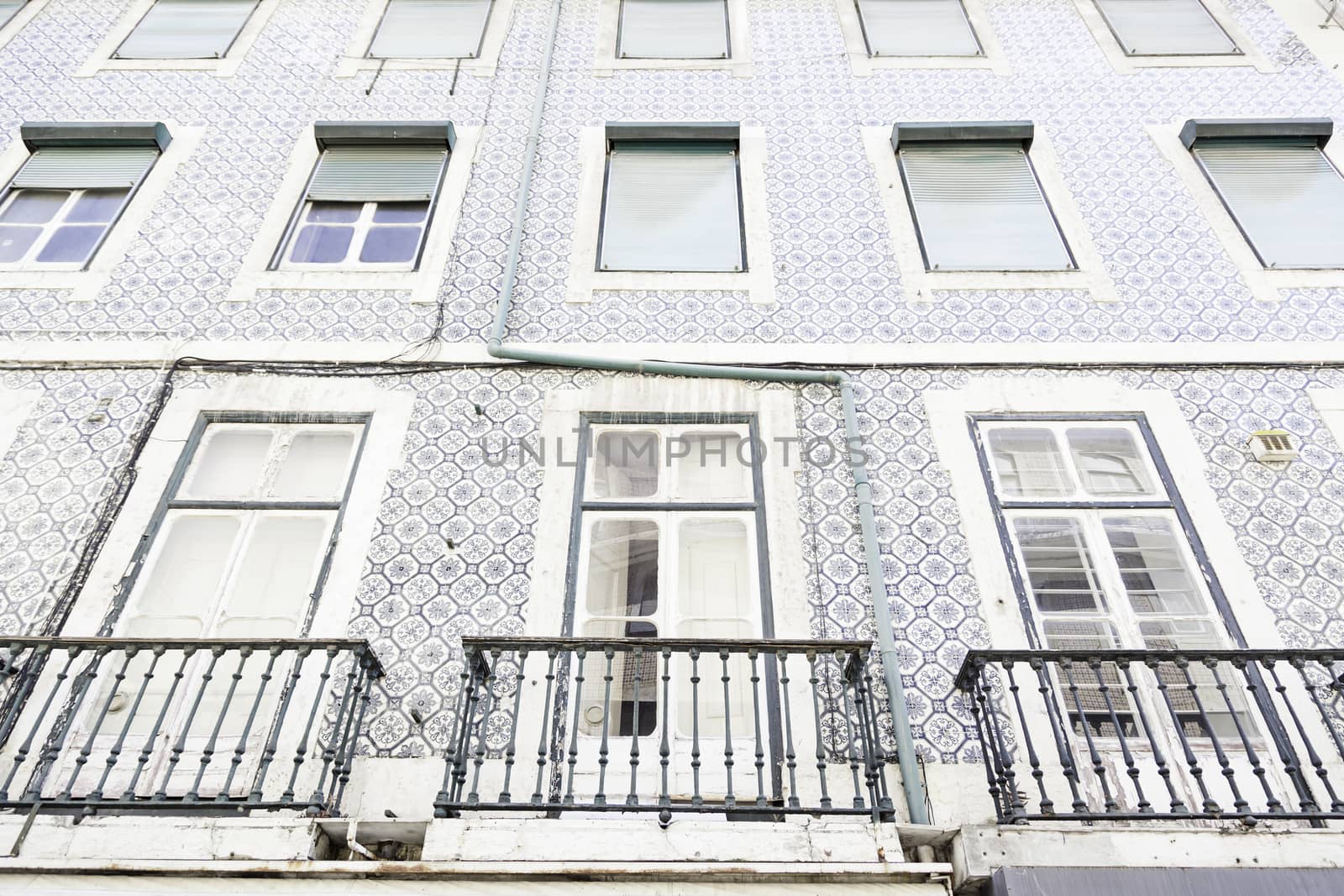 Typical facade tiles in Lisbon, facade detail of an ancient decorated