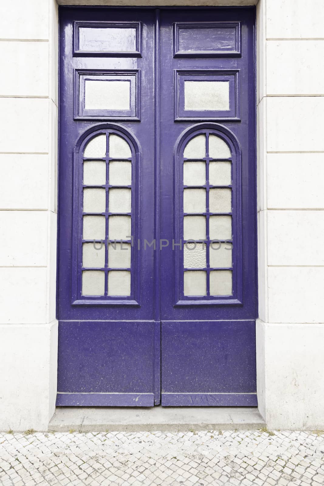 Classic blue door, detail of a door in a house, security and