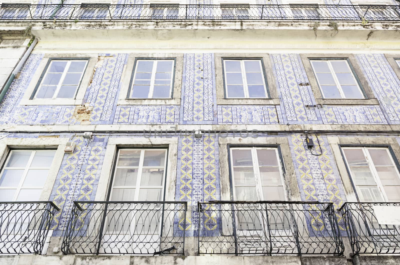 Typical facade tiles in Lisbon, facade detail of an ancient decorated