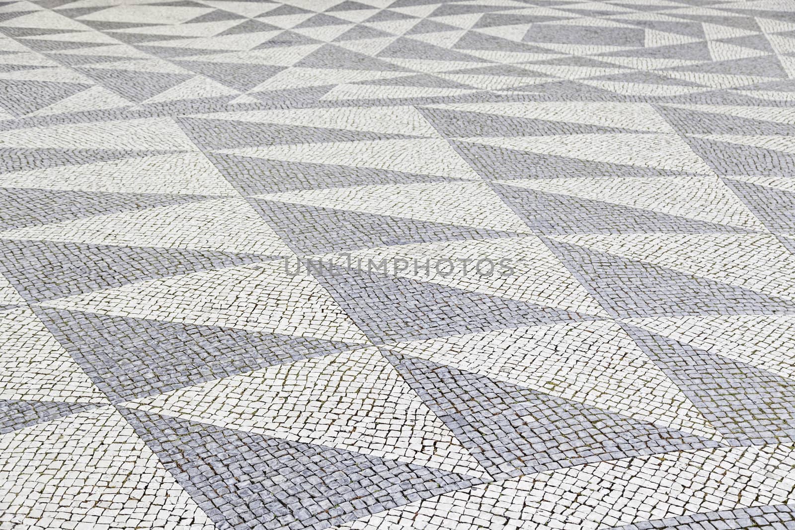 Typical stone floor Lisbon, detail of a typical floor with shapes and drawings, art Portugal, tourism