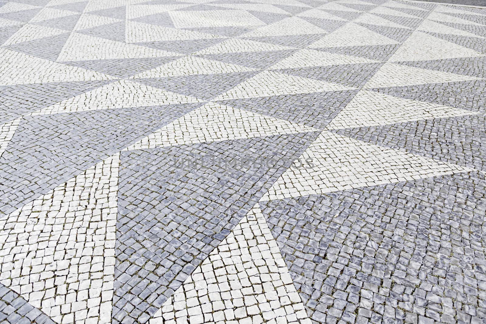Typical stone floor Lisbon, detail of a typical floor with shapes and drawings, art Portugal, tourism