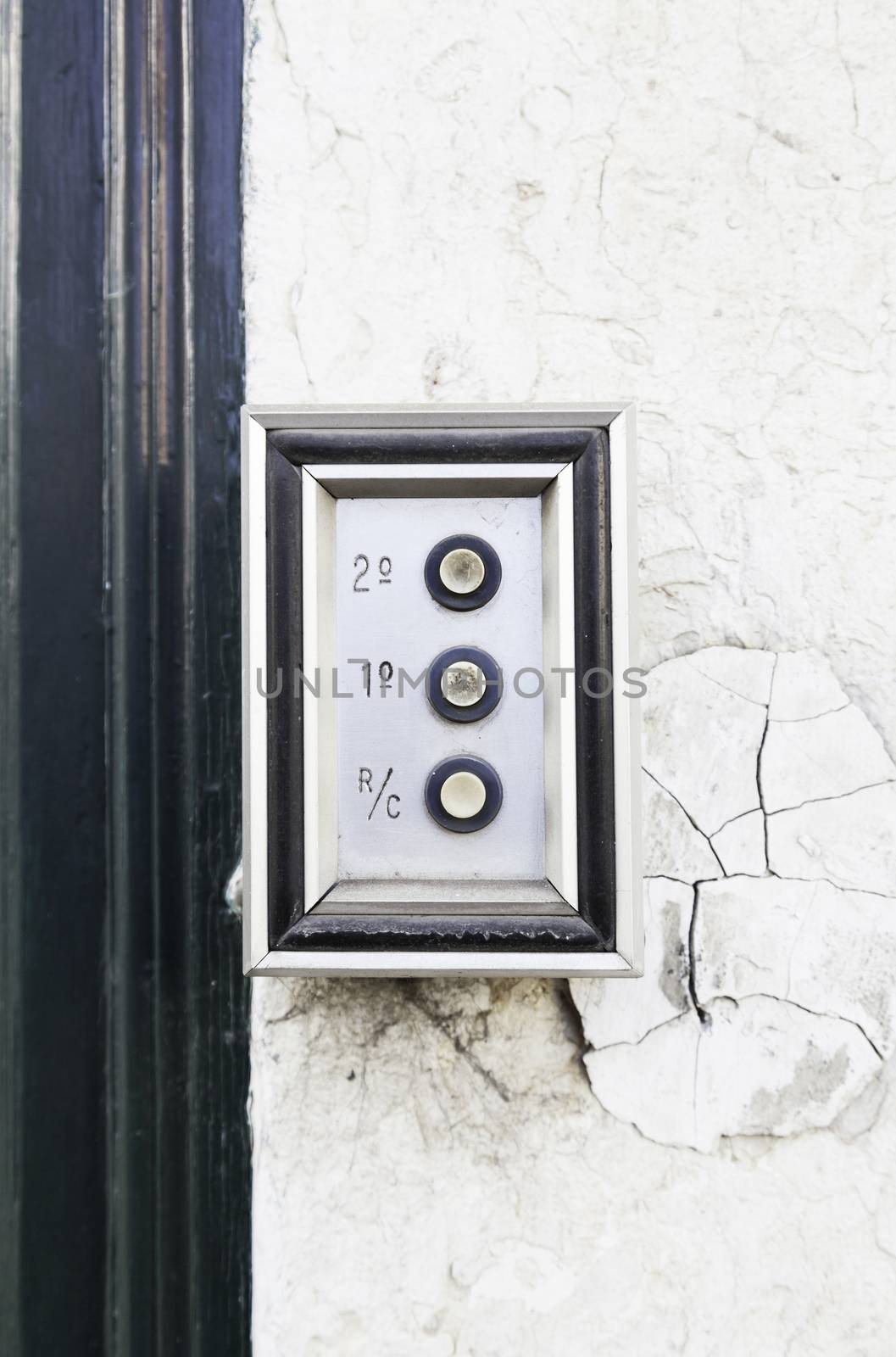 Old intercom on a street in Lisbon, detail of a home electric appliance