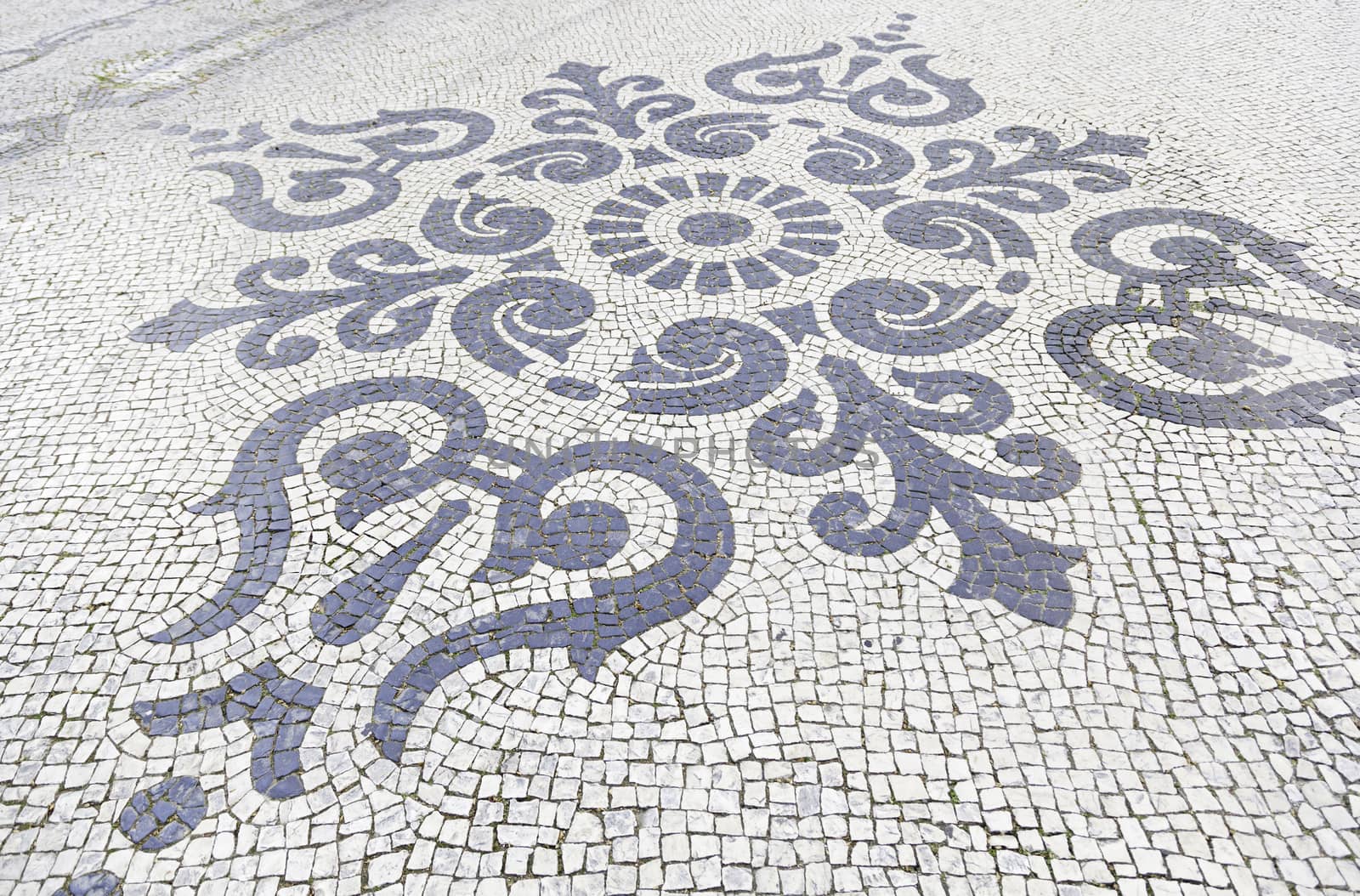 Lisbon typical mosaic, detail of a mosaic in an old typical Lisbon street, urban art