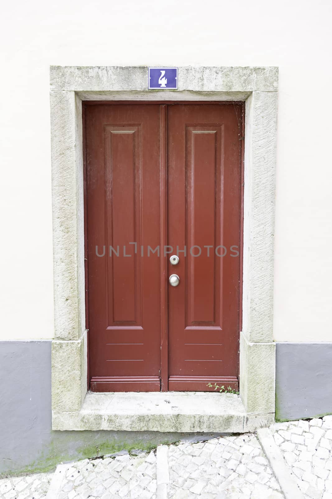 Classic wooden door, detail of a closed door decoration in the city