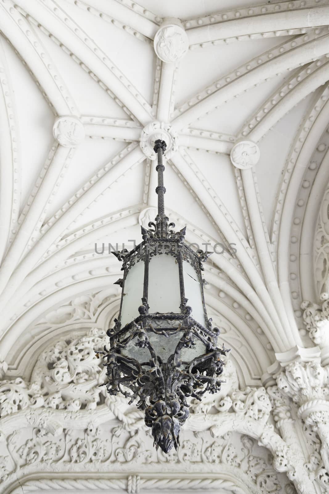 Old street lamp on the ceiling, detail of a lamp to illuminate