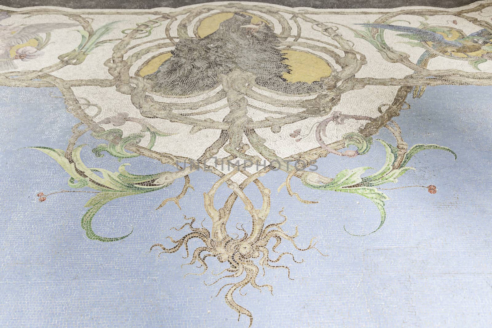 Old stone mosaic, detail of a wall decorated with colored stones, textured background