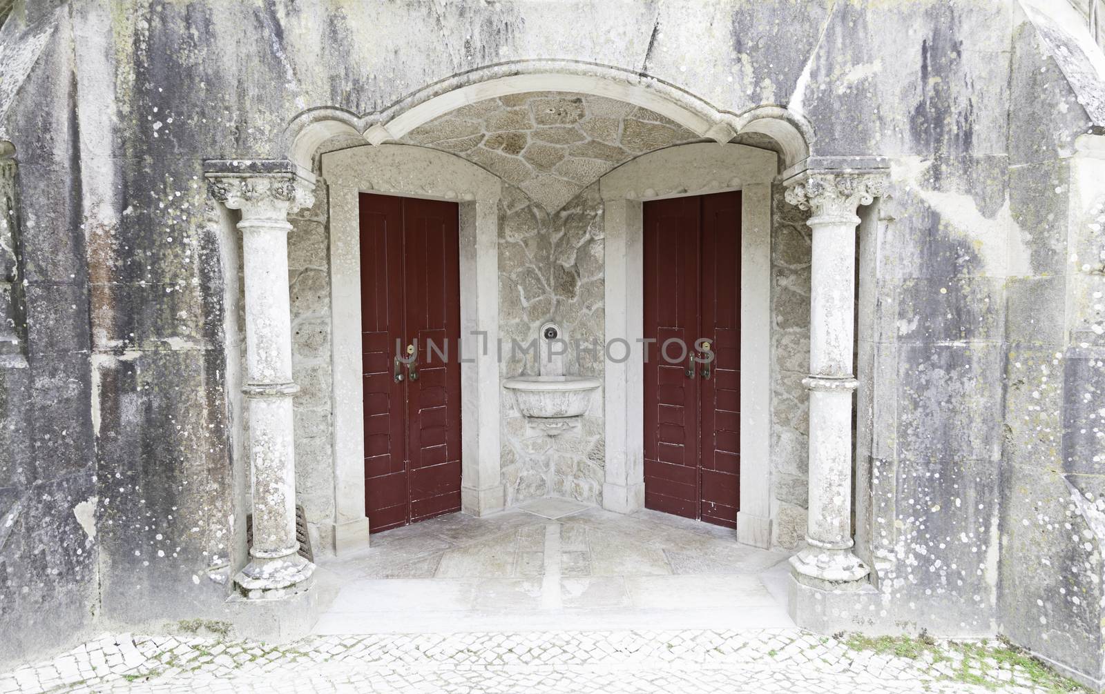 Door and window old, abandoned, detail of the facade of an old stone house