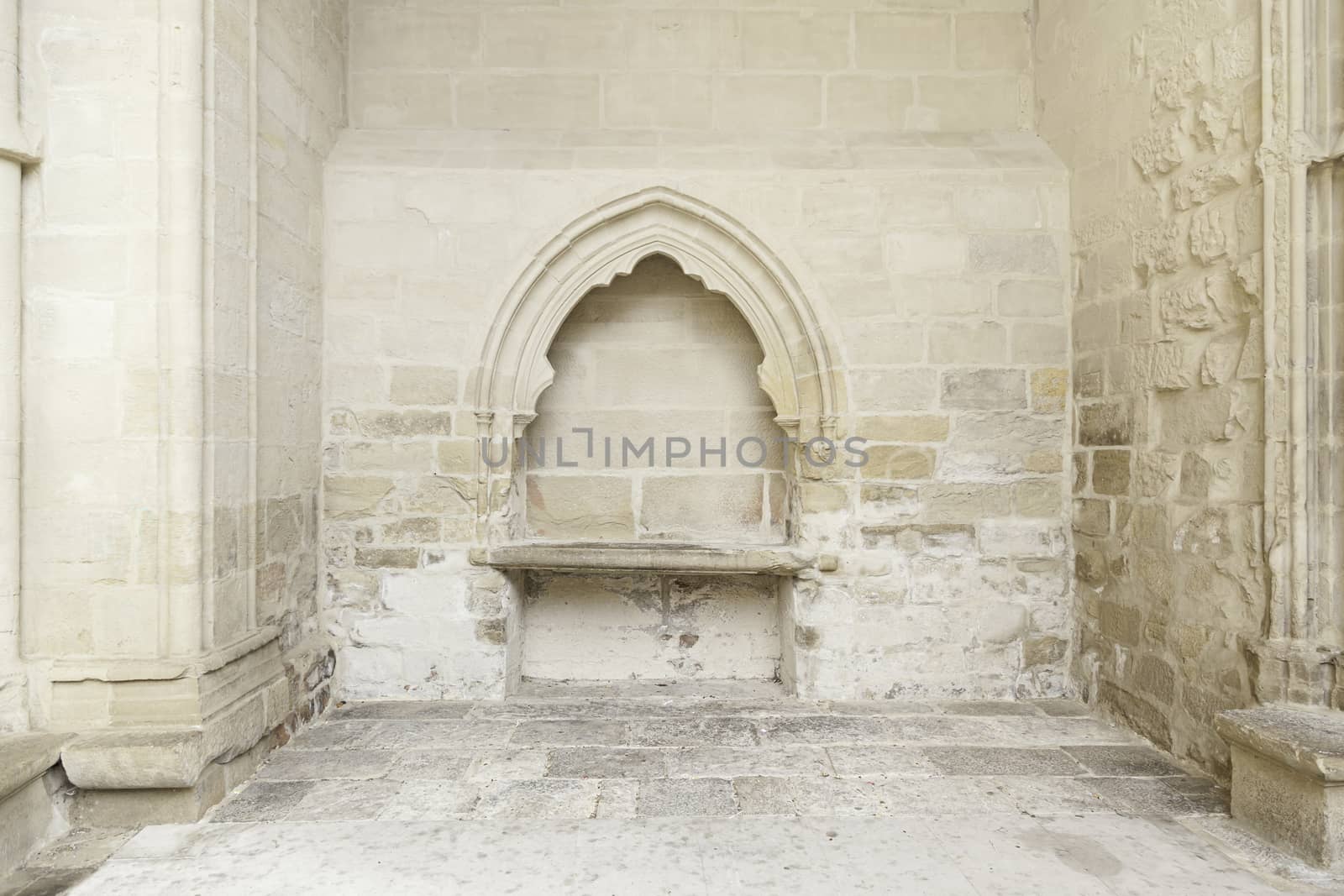 Stone wall inside a church, detail of the interior of a monument in ruins, ruin and abandonment