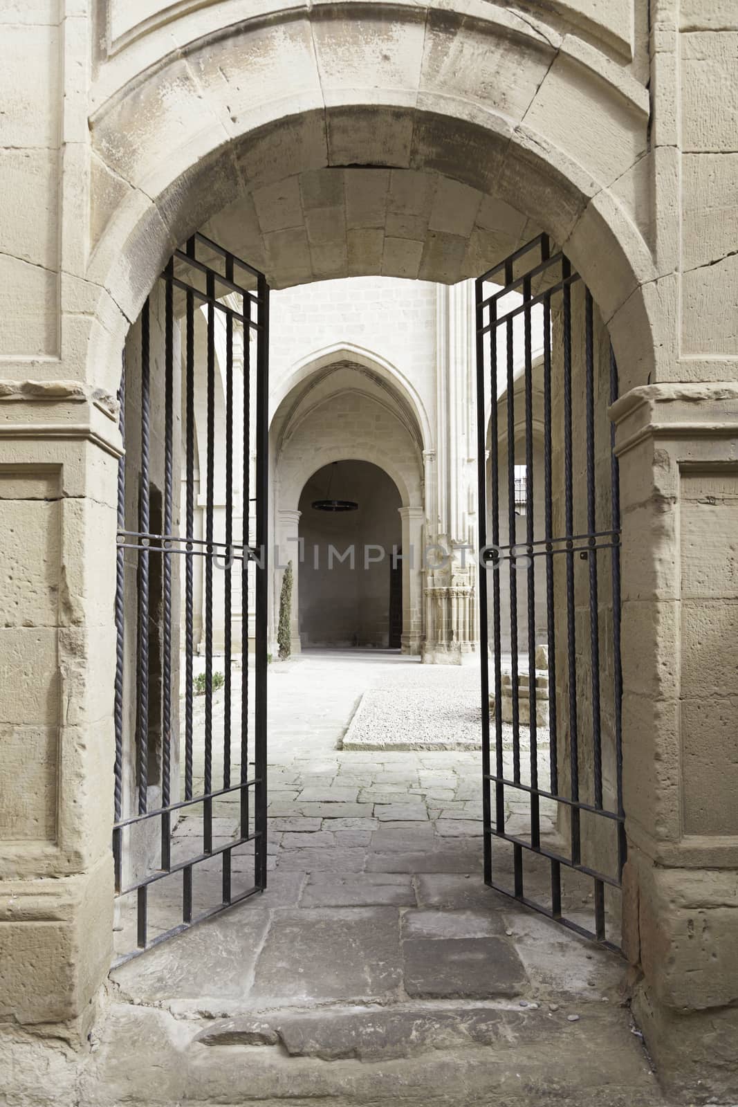 Old metal gate in a medieval church, detail of a door in a church abanonada ancient medieval monument
