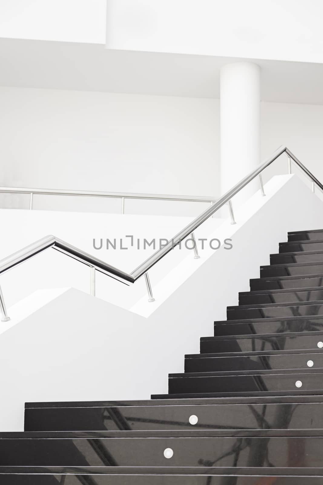 Black marble stairs, detail of the interior of a modernist building, modern architecture