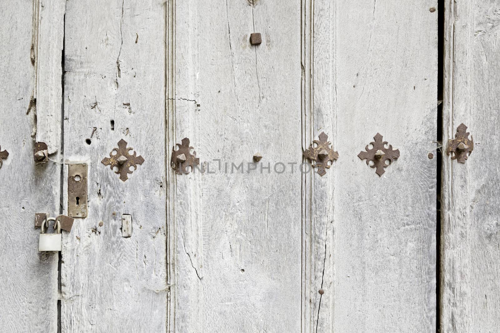 Abandoned wooden old door, detail of a door in the city, neglect and ruin, antique