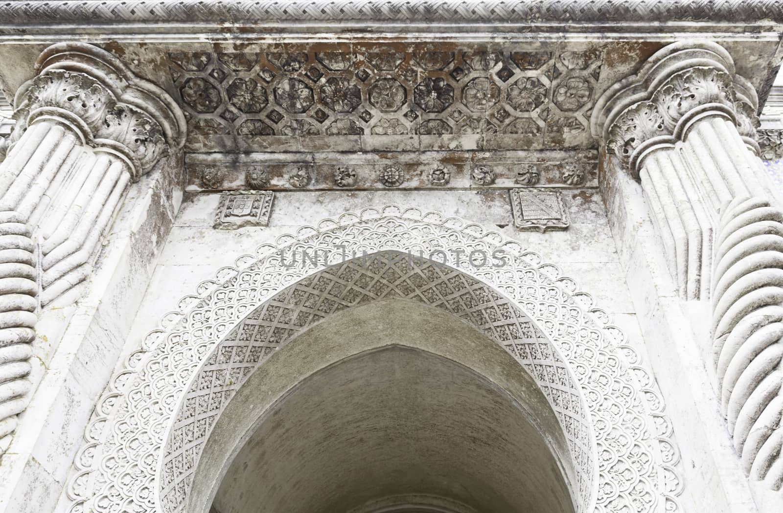 Stone arch decorated, detail of a wall decorated in stone, ancient art