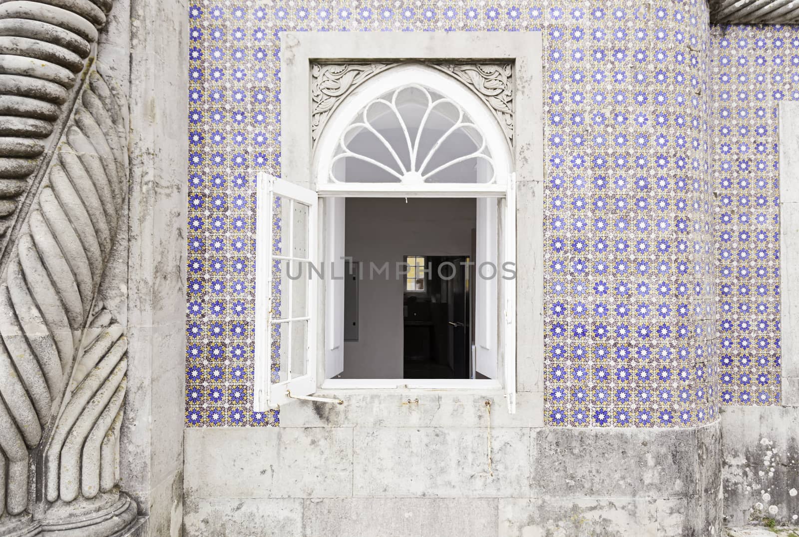 Old facade with typical tiles from Lisbon, detail of a decorated wall, typical architecture of Portugal