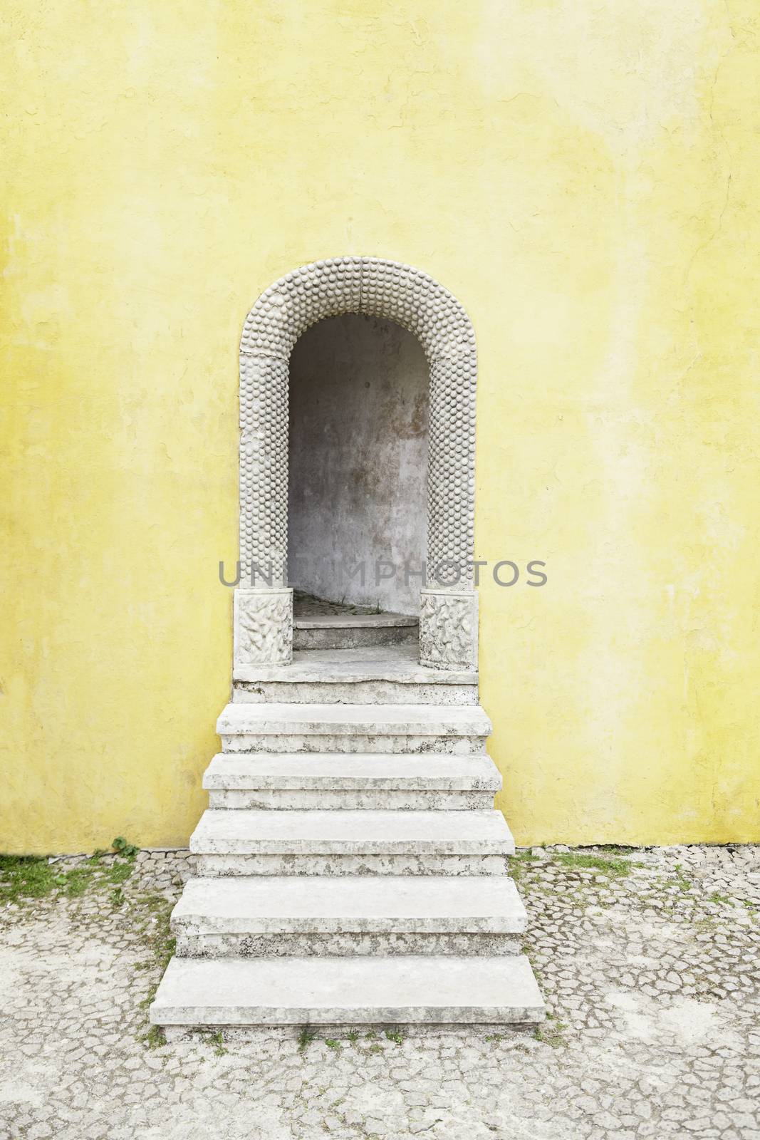 Old door decorated in Sintra, detail of decoration in a castle in Portugal, Manueline arches decorated